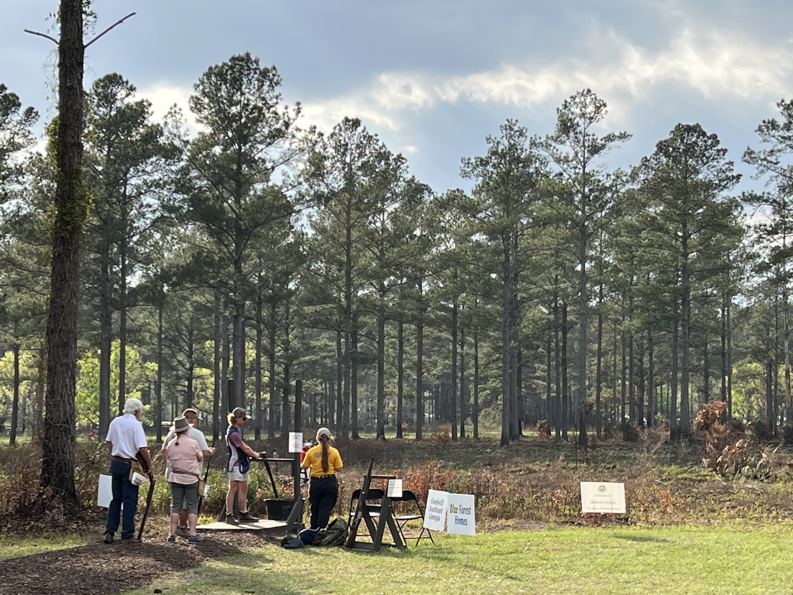 Group of people setting up for shooting competition